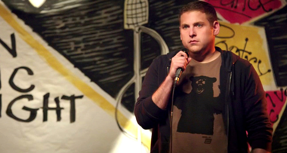 Jonah Hill lighting up the stage wearing an Ames Bros Big Bear T-Shirt in 22 Jump Street the Movie